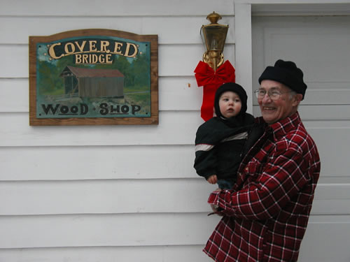 Peter Usselmann with the shop sign